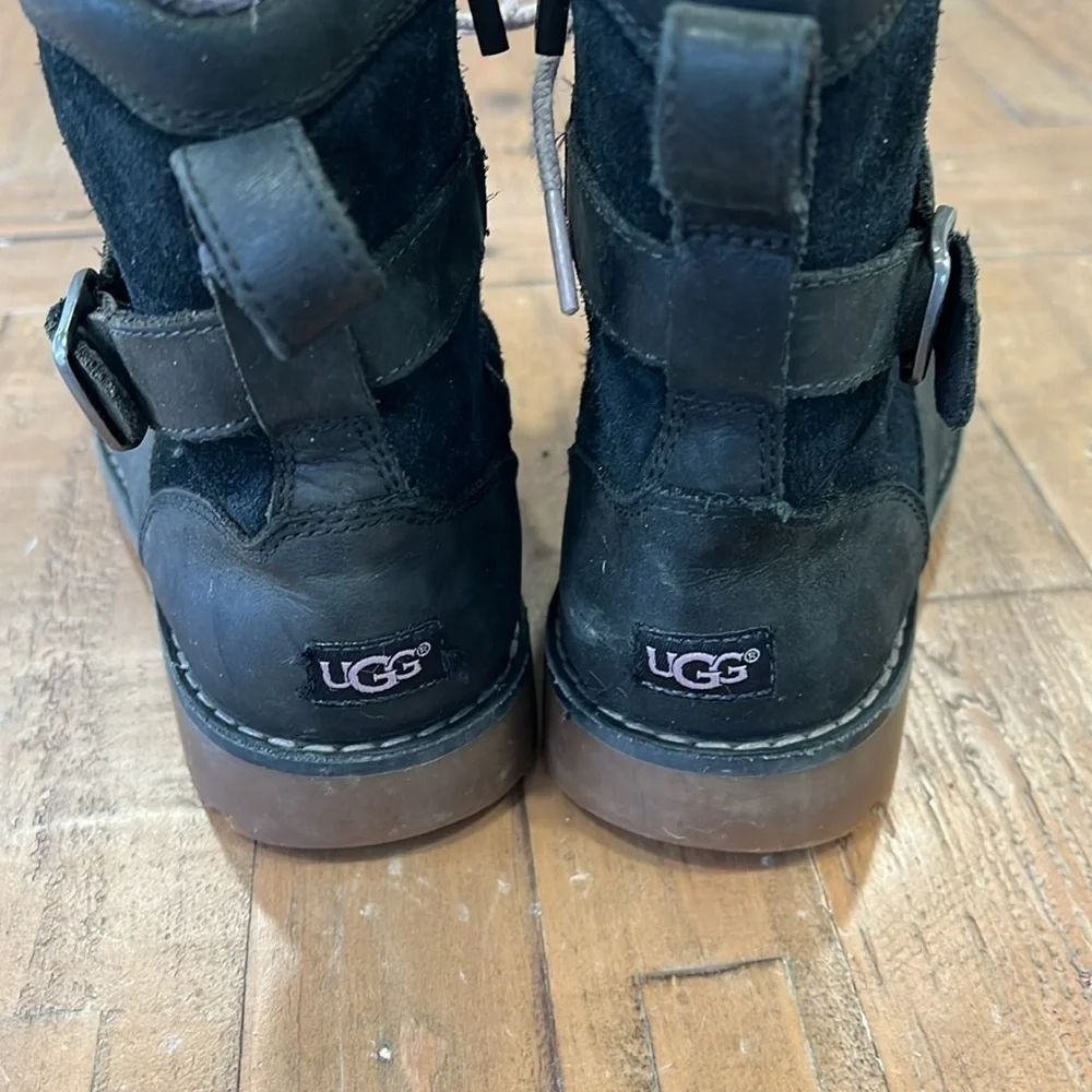 Ugg Koren black leather buckle strap lug sole boots